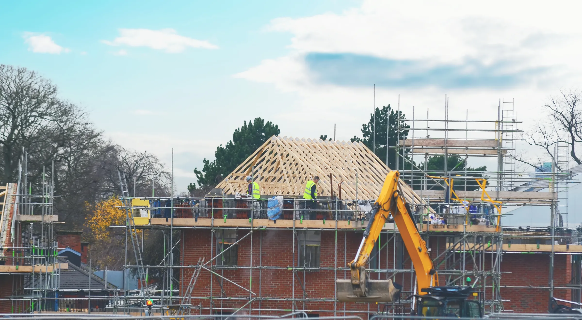 Roofer working on roof battens and membrane